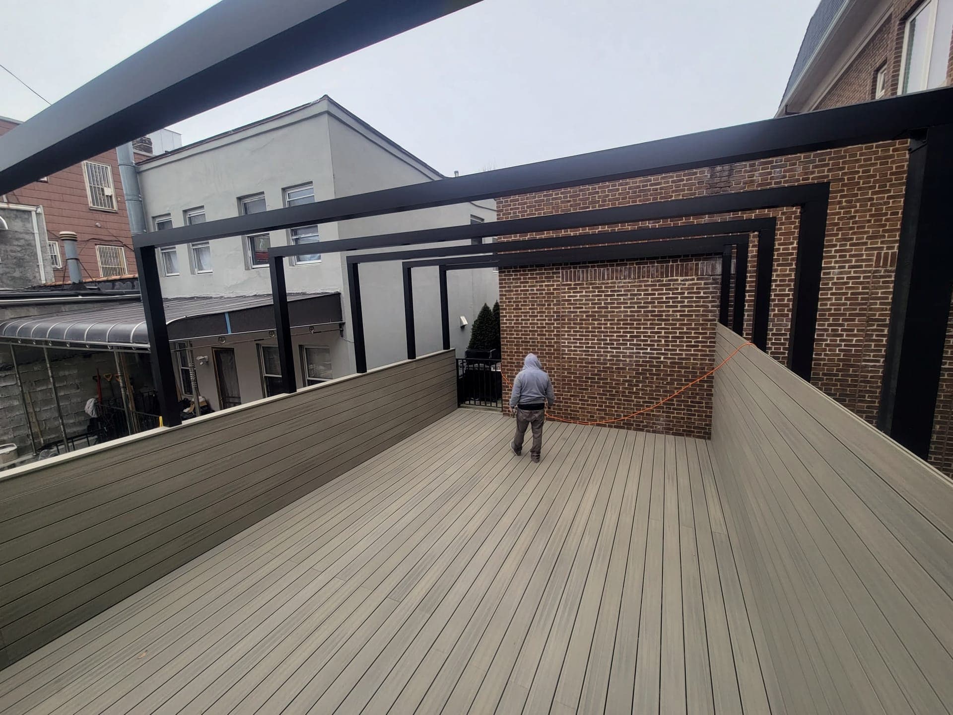Rooftop Deck & Pergola — Finished rooftop deck with steel pergola