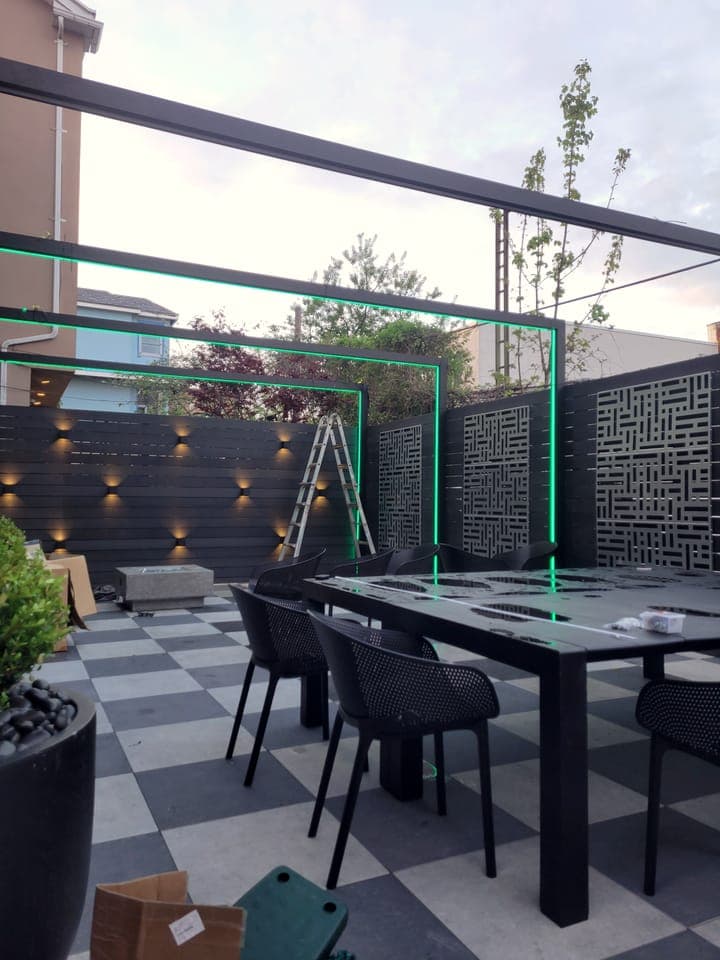 Checkerboard Patio Garden — Dusk patio with green LED lighting
