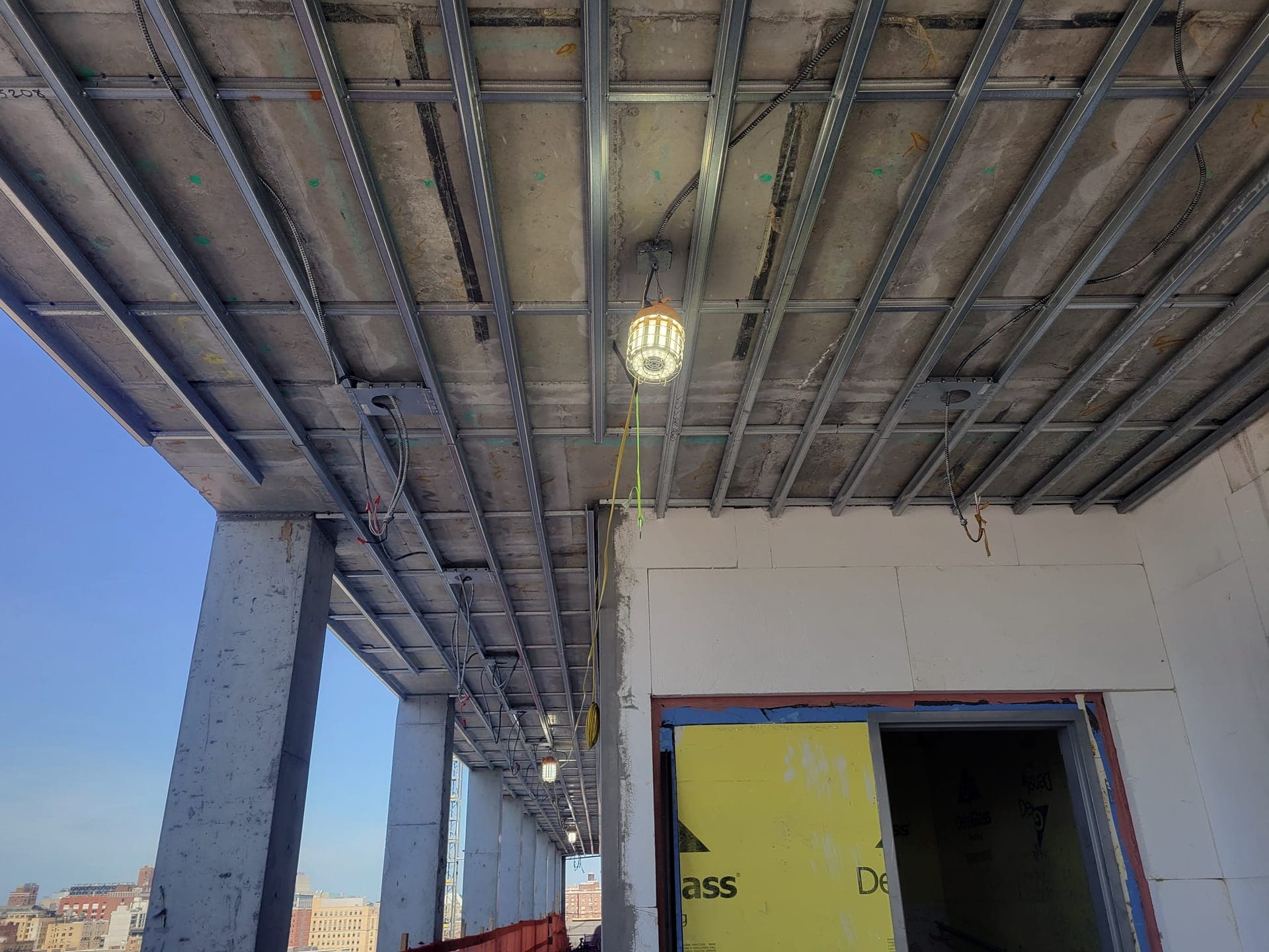 Suspended Wood Soffit — before: Steel ceiling framing in progress