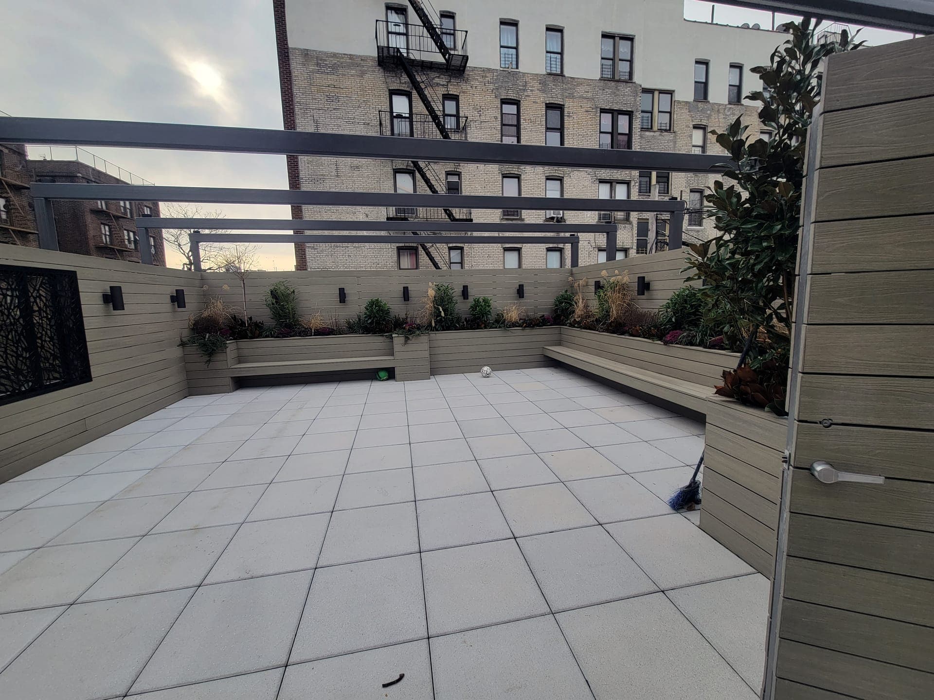 Crown Heights Rooftop — after: Finished terrace, planted greenery