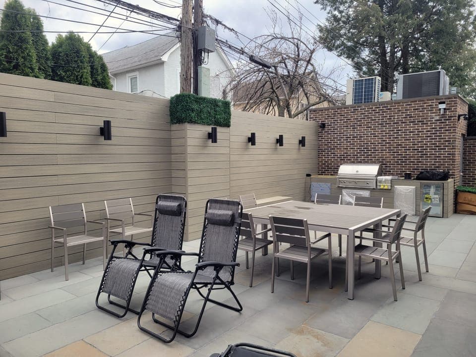 Brick-Walled Backyard — Dining set and grill station