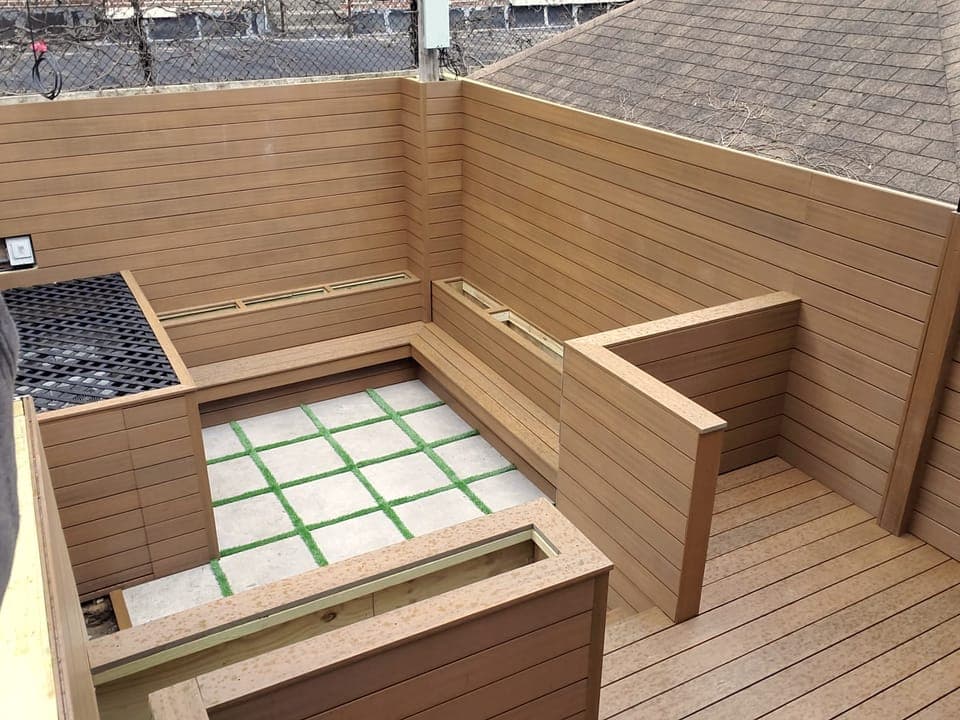 Wood-Clad Backyard Retreat — Finished benches and planters