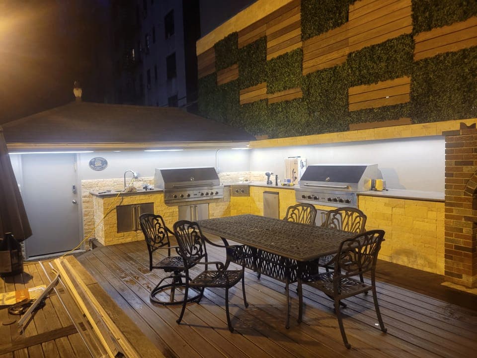 Rooftop Privacy Wall — Privacy wall and kitchen at night